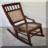 F76. Caned rocking chair. Some breakage to cane. 32”h - $48 